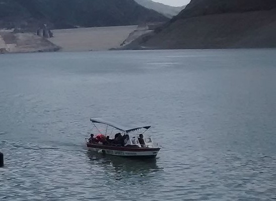 Blue lake with hills