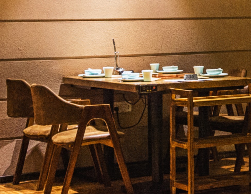 Warm café table with coffee and pastries